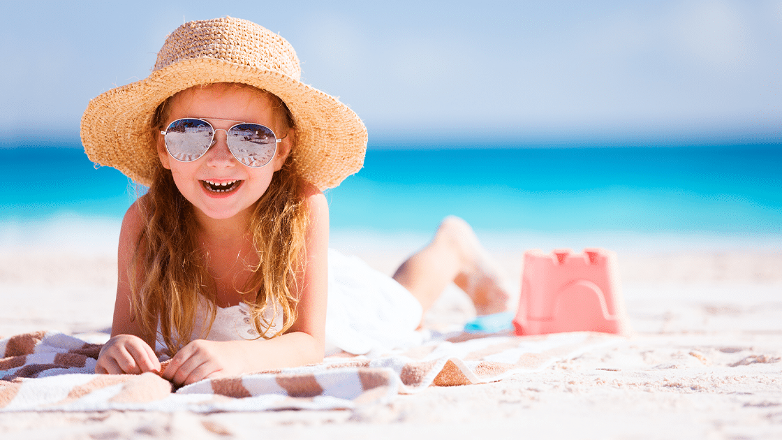 Child With Hat On The Beach 