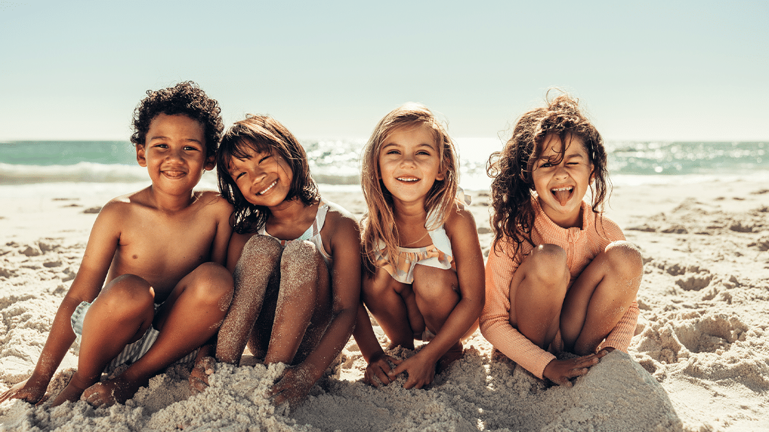 Kids Sitting On The Beach